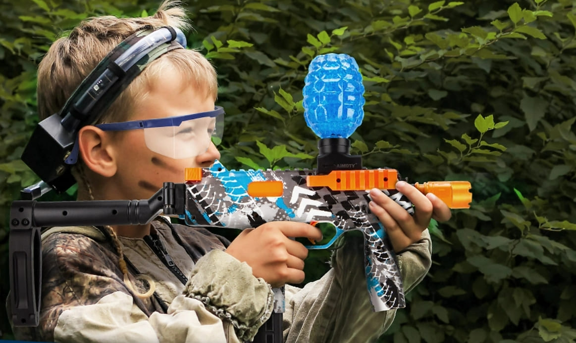 Children playing with biodegradable gel balls outdoors.