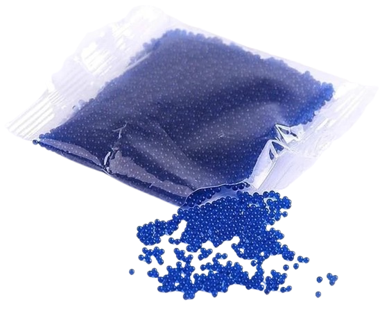 Clear plastic bag with blue beads spilling out on a white background